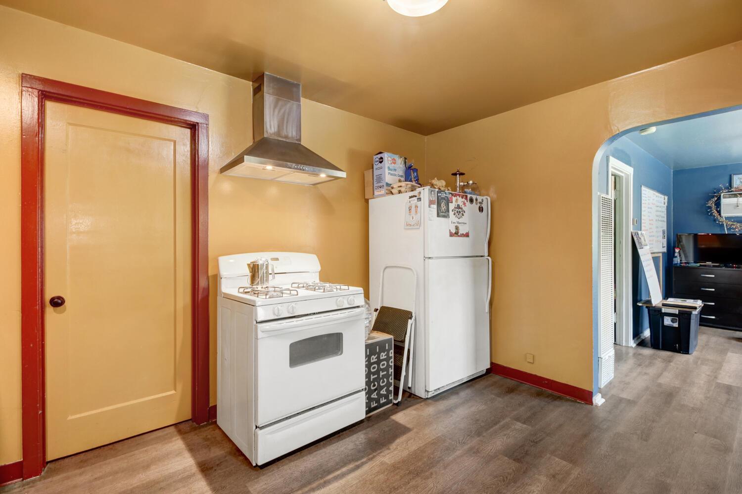 218 Folsom Road Roseville, CA 95678 - Photo 27 of 37 a view of a kitchen with refrigerator and wooden floor
