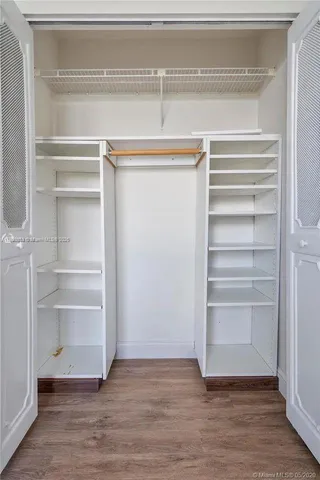 an aerial view of a house with garden space and street view