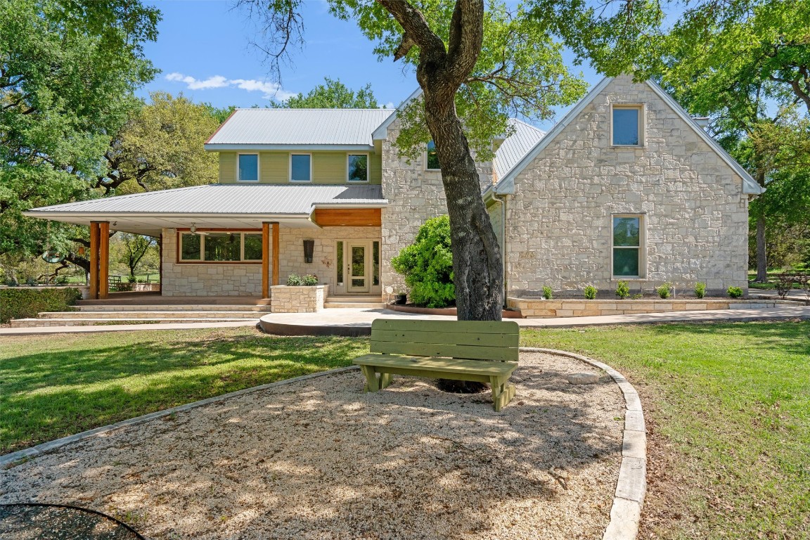 33 Long Creek Road Austin, TX 78737 - Photo 1 of 39 a front view of a house with a yard