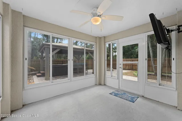 a view of an empty room with a window