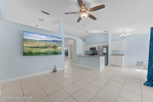 a view of kitchen with furniture and window