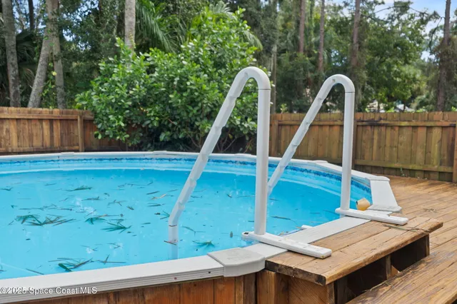 an aerial view of a house with pool