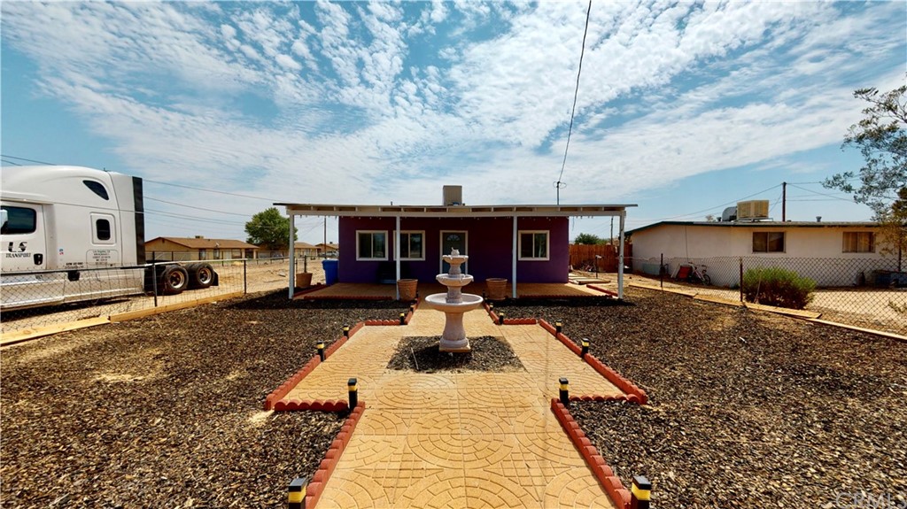 34851 Birch Road Barstow, CA 92311 - Photo 1 of 1 a front view of a house with garden
