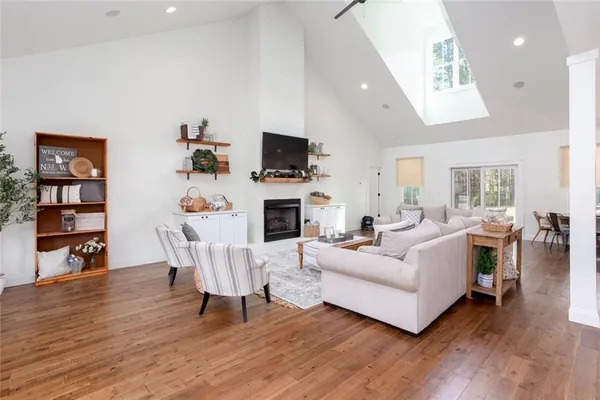 a view of a house with pool and a big yard