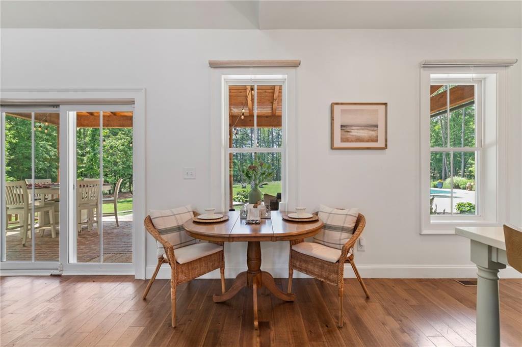 1273 Villa Rica Road Powder Springs, GA 30127 - Photo 19 of 69 a view of a dining room with furniture window and wooden floor
