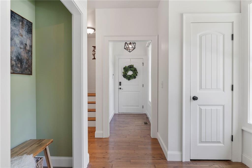 1273 Villa Rica Road Powder Springs, GA 30127 - Photo 33 of 69 a view of a hallway with wooden floor and closet