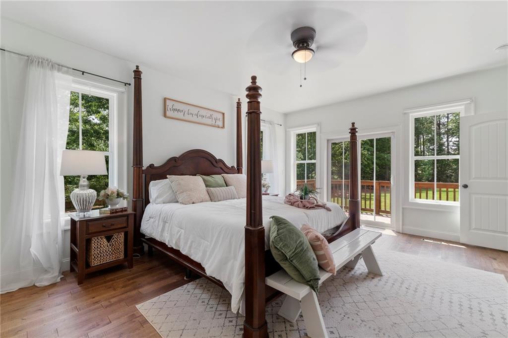 1273 Villa Rica Road Powder Springs, GA 30127 - Photo 37 of 69 a spacious bedroom with a bed and a large window
