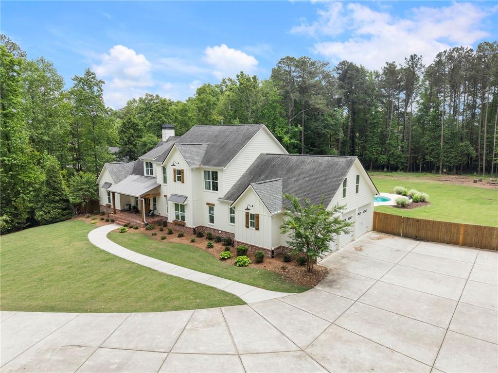 1273 Villa Rica Road Powder Springs, GA 30127 - Photo 5 of 69 a house with green field in front of it