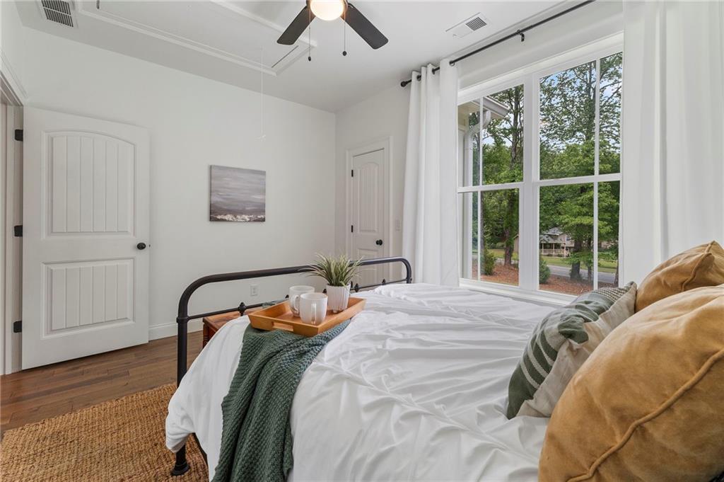 1273 Villa Rica Road Powder Springs, GA 30127 - Photo 54 of 69 a bed sitting in a bedroom next to a window