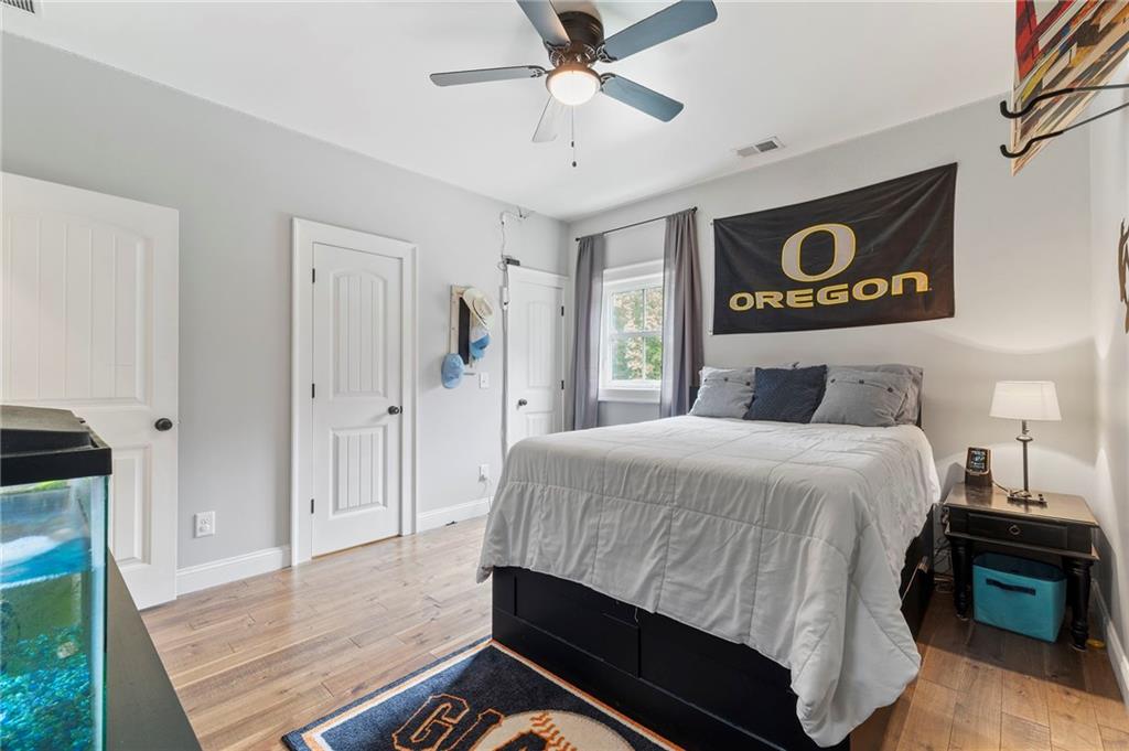 1273 Villa Rica Road Powder Springs, GA 30127 - Photo 57 of 69 a bedroom with a bed and a view of kitchen