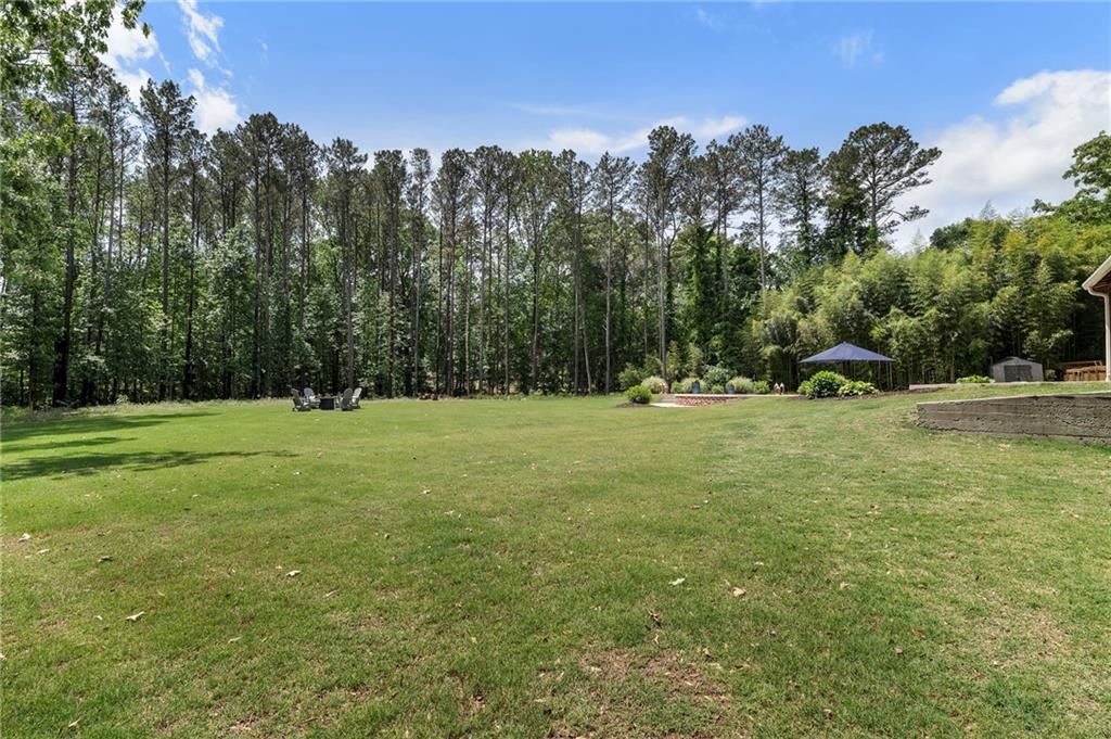 1273 Villa Rica Road Powder Springs, GA 30127 - Photo 59 of 69 a view of outdoor space with green field and trees