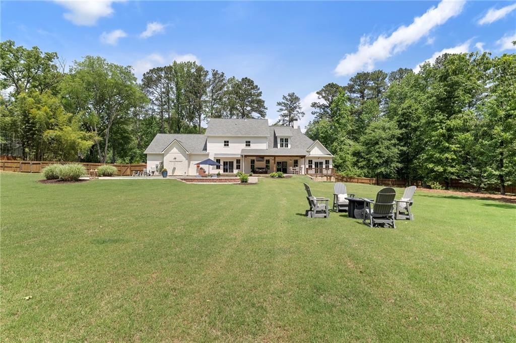 1273 Villa Rica Road Powder Springs, GA 30127 - Photo 60 of 69 a view of a house with patio and garden