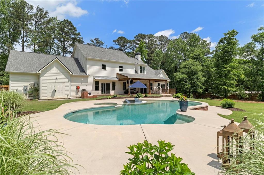 1273 Villa Rica Road Powder Springs, GA 30127 - Photo 62 of 69 a front view of a house with garden