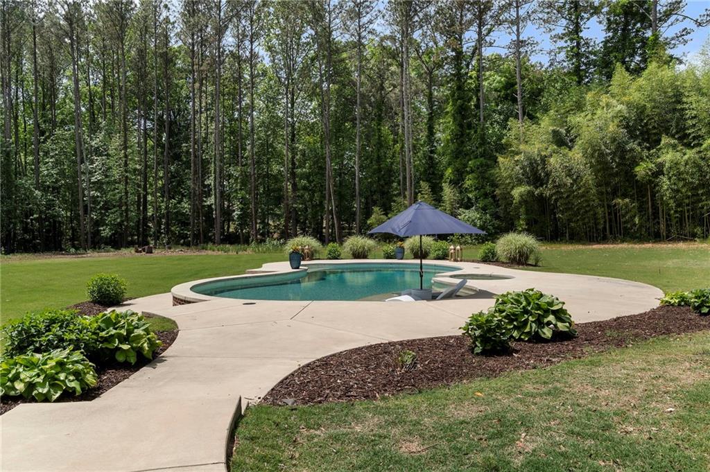 1273 Villa Rica Road Powder Springs, GA 30127 - Photo 66 of 69 a view of a garden with large trees