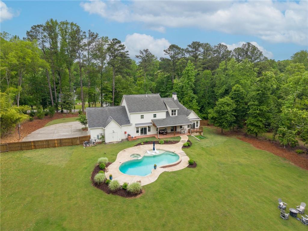 1273 Villa Rica Road Powder Springs, GA 30127 - Photo 67 of 69 an aerial view of a house with swimming pool big yard and large trees