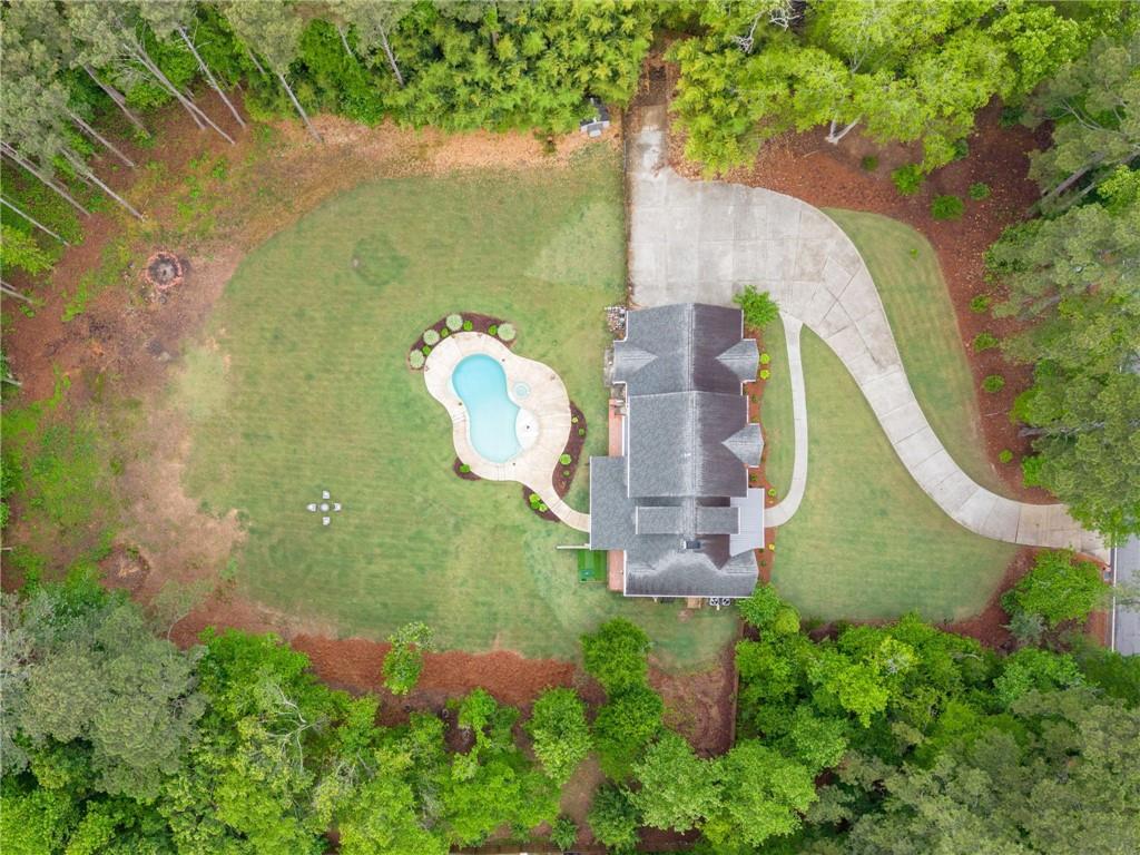 1273 Villa Rica Road Powder Springs, GA 30127 - Photo 69 of 69 an aerial view of a house with a garden and trees