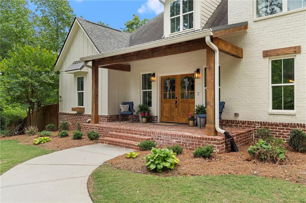 1273 Villa Rica Road Powder Springs, GA 30127 - Photo 7 of 69 a front view of a house with a yard