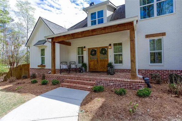 a view of a swimming pool with a patio