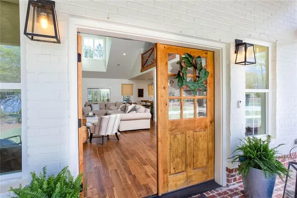 a view of a patio with table and chairs