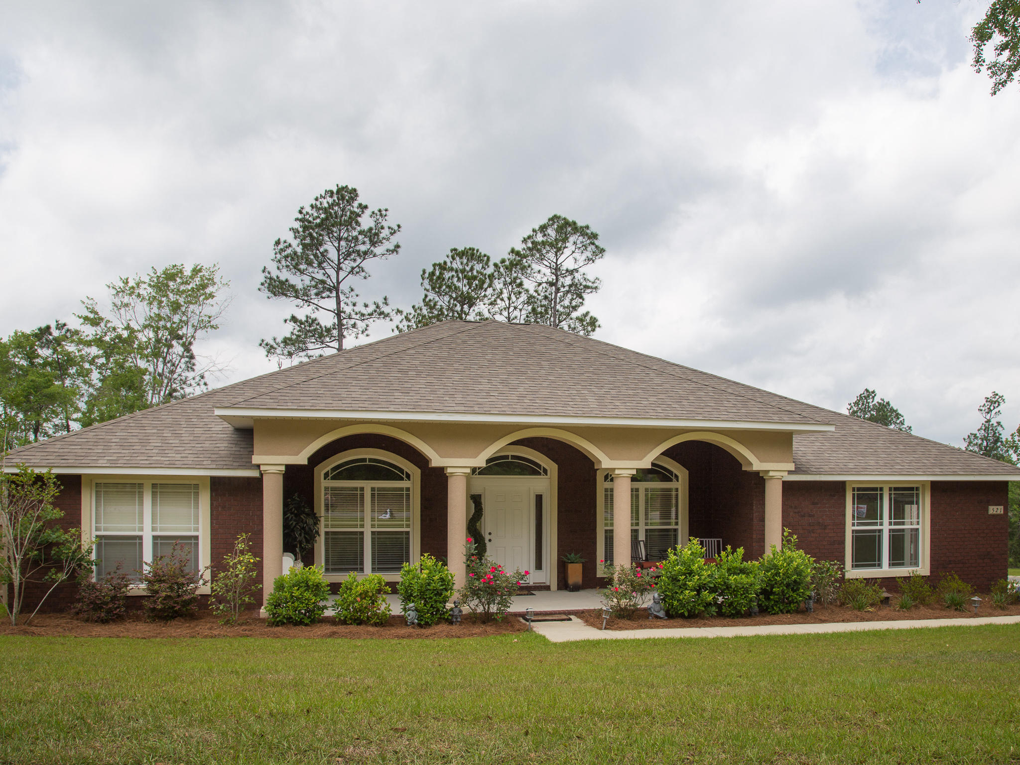 521 Vale Loop Crestview, FL 32536 - Photo 1 of 33 a front view of a house with garden