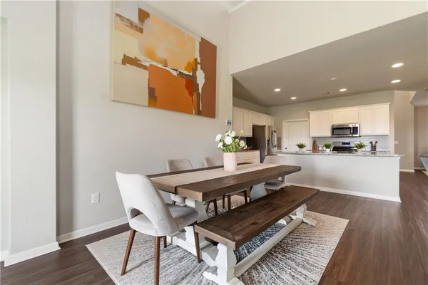 a view of kitchen with cabinets and wooden floor