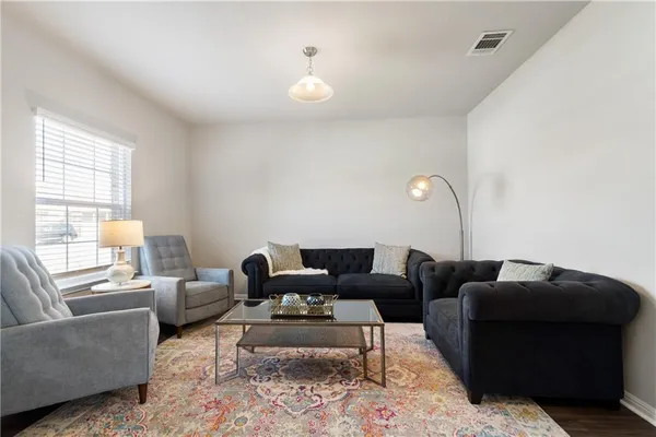 a living room with furniture and a large window