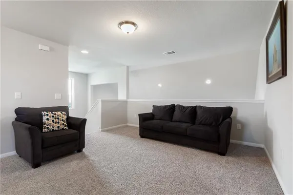a living room with furniture and a couch