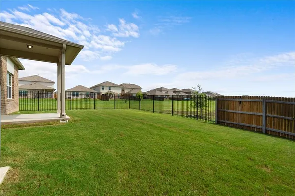 a view of a playground with a big yard