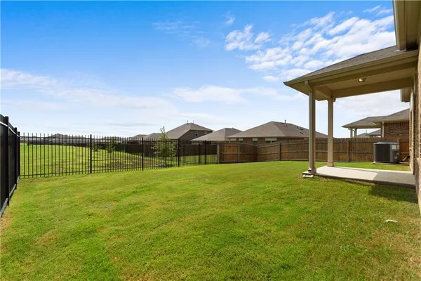 a view of a garden with a lake