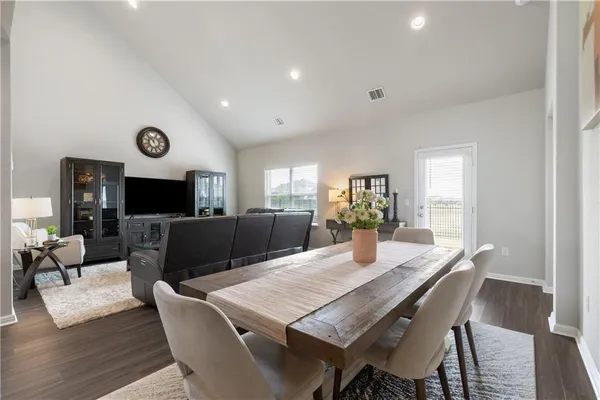 a view of a dining room with furniture window and wooden floor