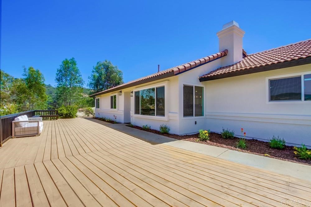 12097 Old Castle Road Valley Center, CA 92082 - Photo 1 of 1 a front view of a house with a yard