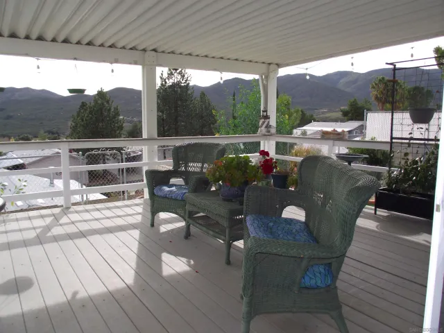 a bathroom with a shower sink and mirror