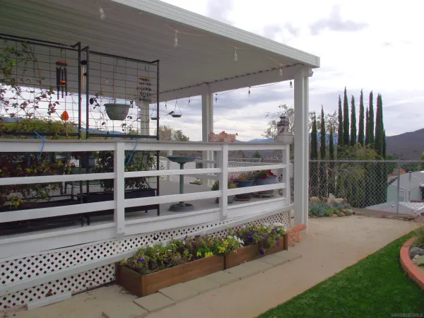 a view of a patio with a table chairs and a table