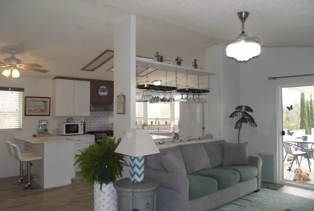 a kitchen with stainless steel appliances a sink stove and cabinets