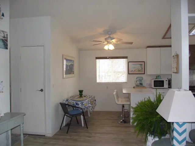 a room with a table and chairs in it