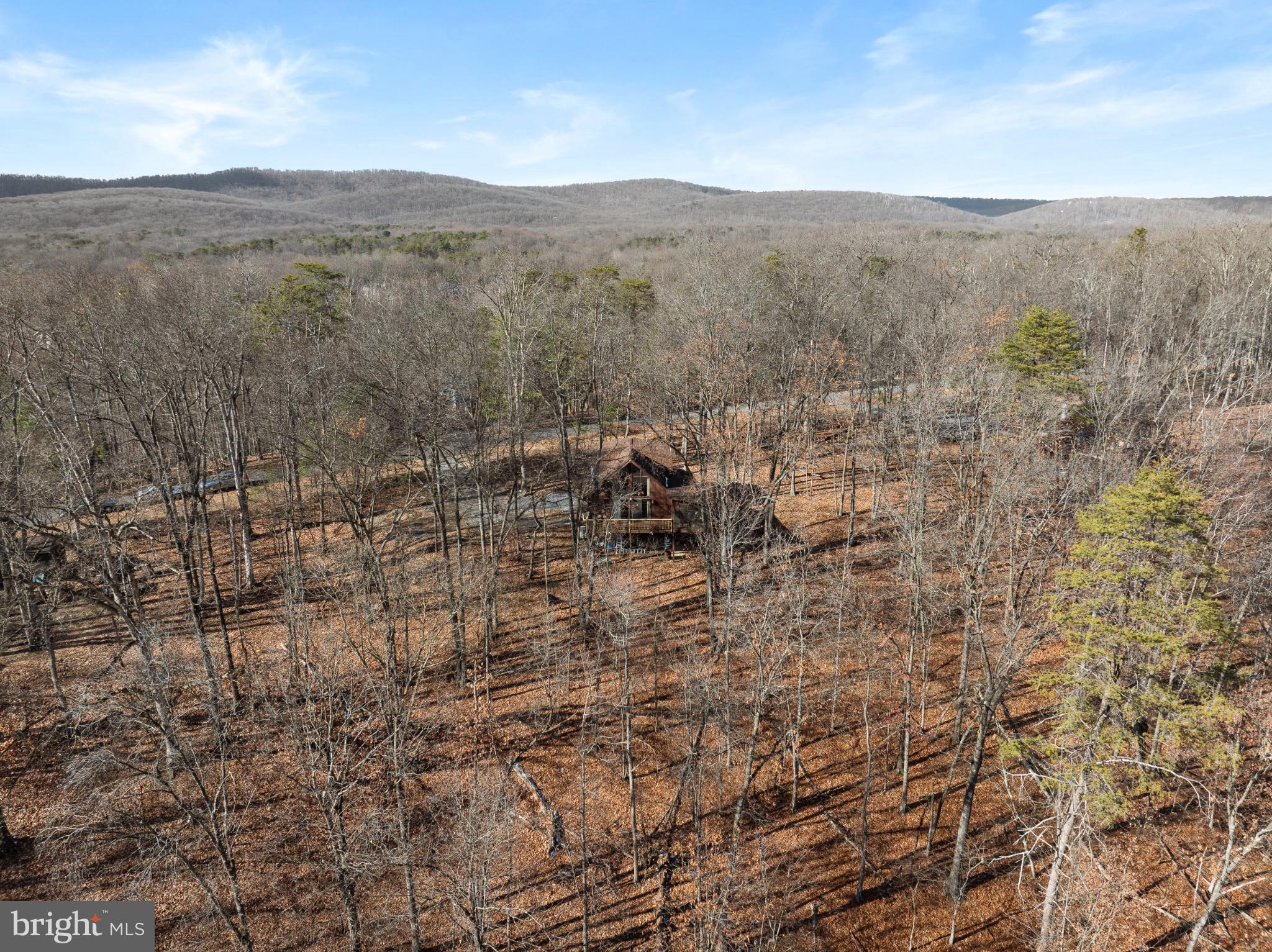 277 Endless Summer Road Hedgesville, WV 25427 - Photo 27 of 33 a view of a dry yard with mountains in the background