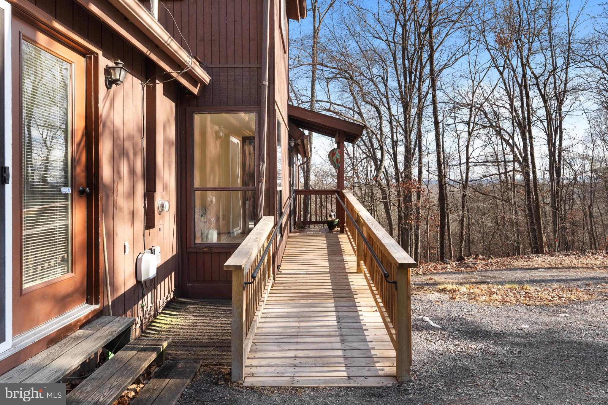 277 Endless Summer Road Hedgesville, WV 25427 - Photo 3 of 33 a view of balcony with wooden floor and fence