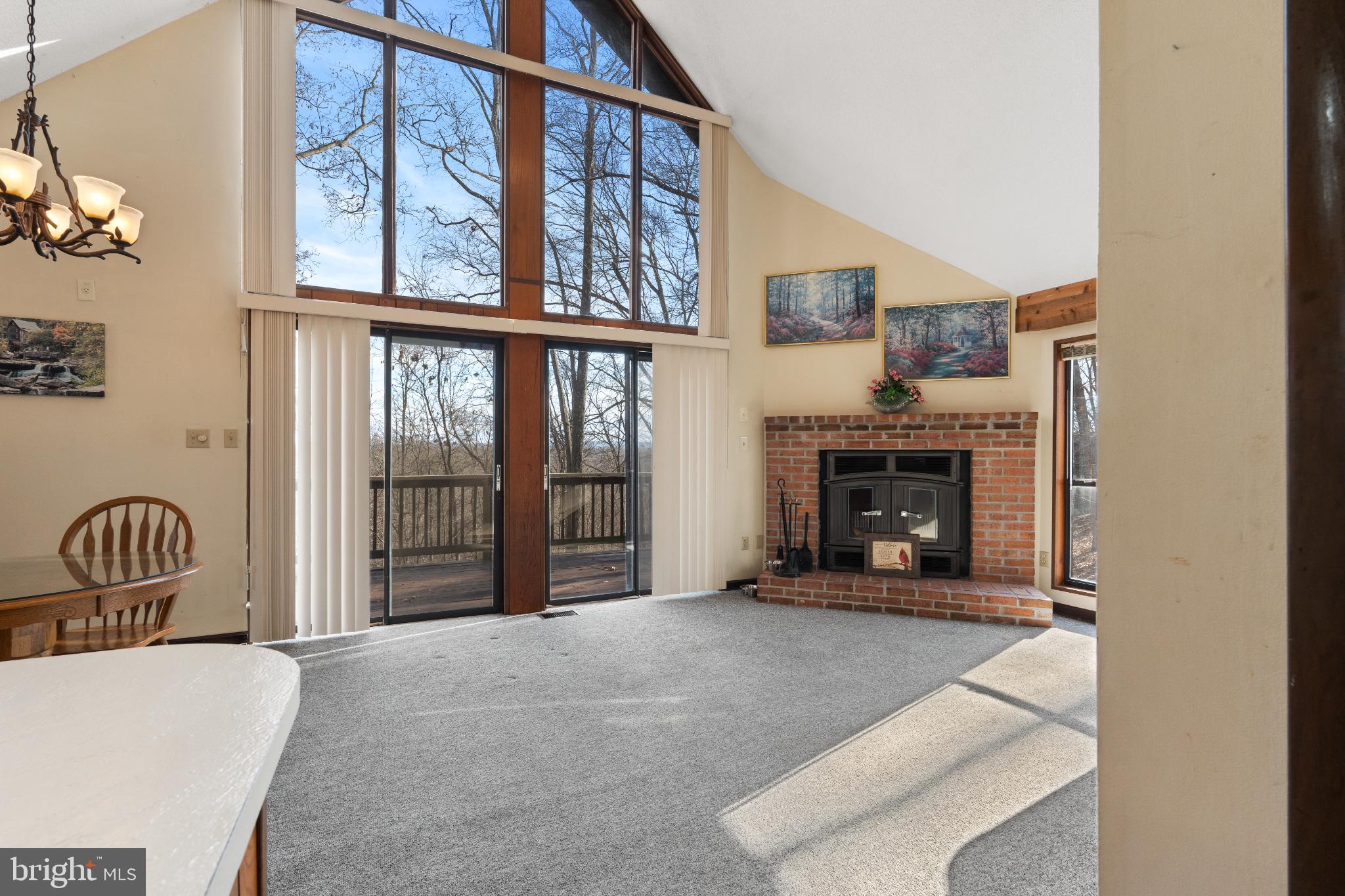 277 Endless Summer Road Hedgesville, WV 25427 - Photo 4 of 33 a living room with furniture and a fireplace