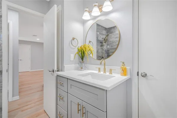 a bathroom with a sink and a mirror