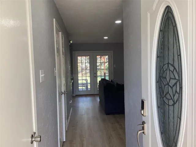 a view of entryway with wooden floor