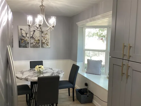 a view of a dining room with furniture window and outside view