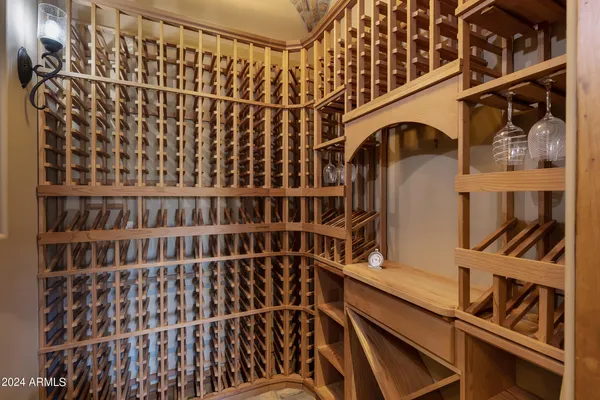 a bathroom with a granite countertop sink a mirror and a toilet