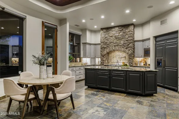a reading room with furniture and a potted plant