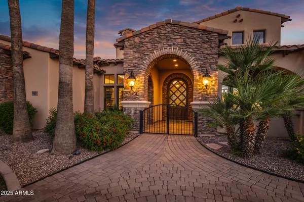 a front view of a house with swimming pool and porch with seating space