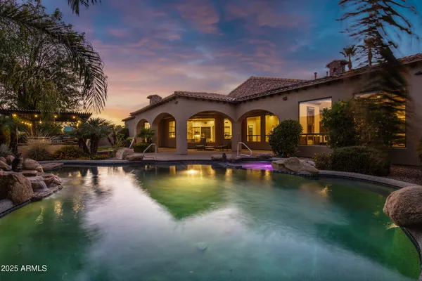 a view of a swimming pool with sitting area