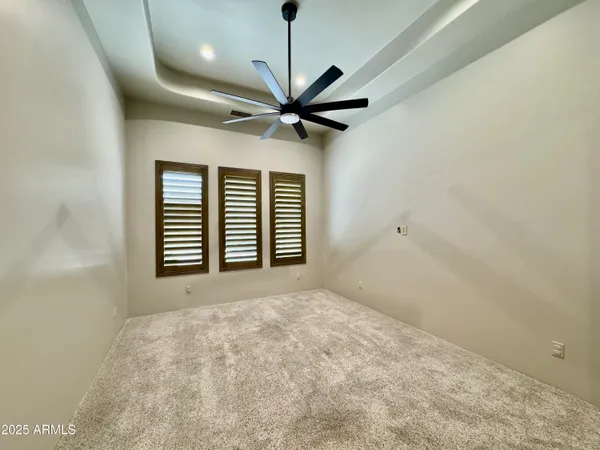 a view of a swimming pool with a patio and a yard