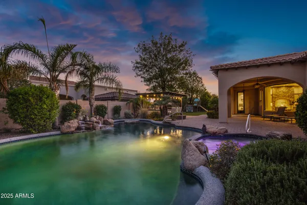 a view of a swimming pool with outdoor space and seating area
