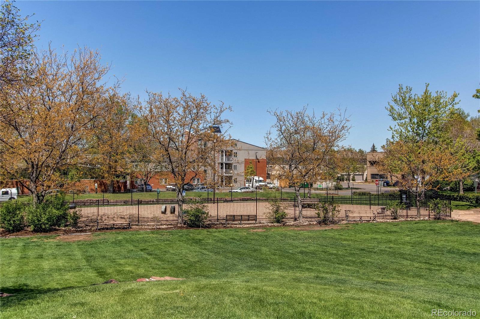 4824 East Kentucky Avenue, Unit C Denver, CO 80246 - Photo 16 of 17 a garden with trees in the background