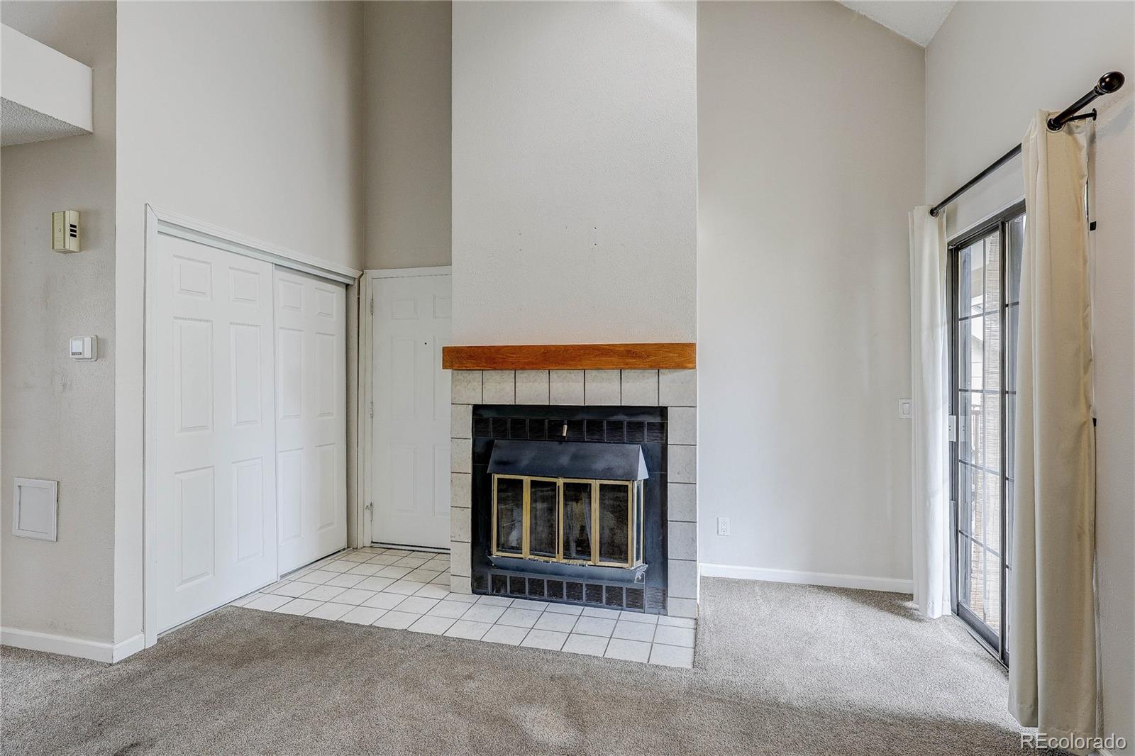 4824 East Kentucky Avenue, Unit C Denver, CO 80246 - Photo 4 of 17 a living room with fireplace