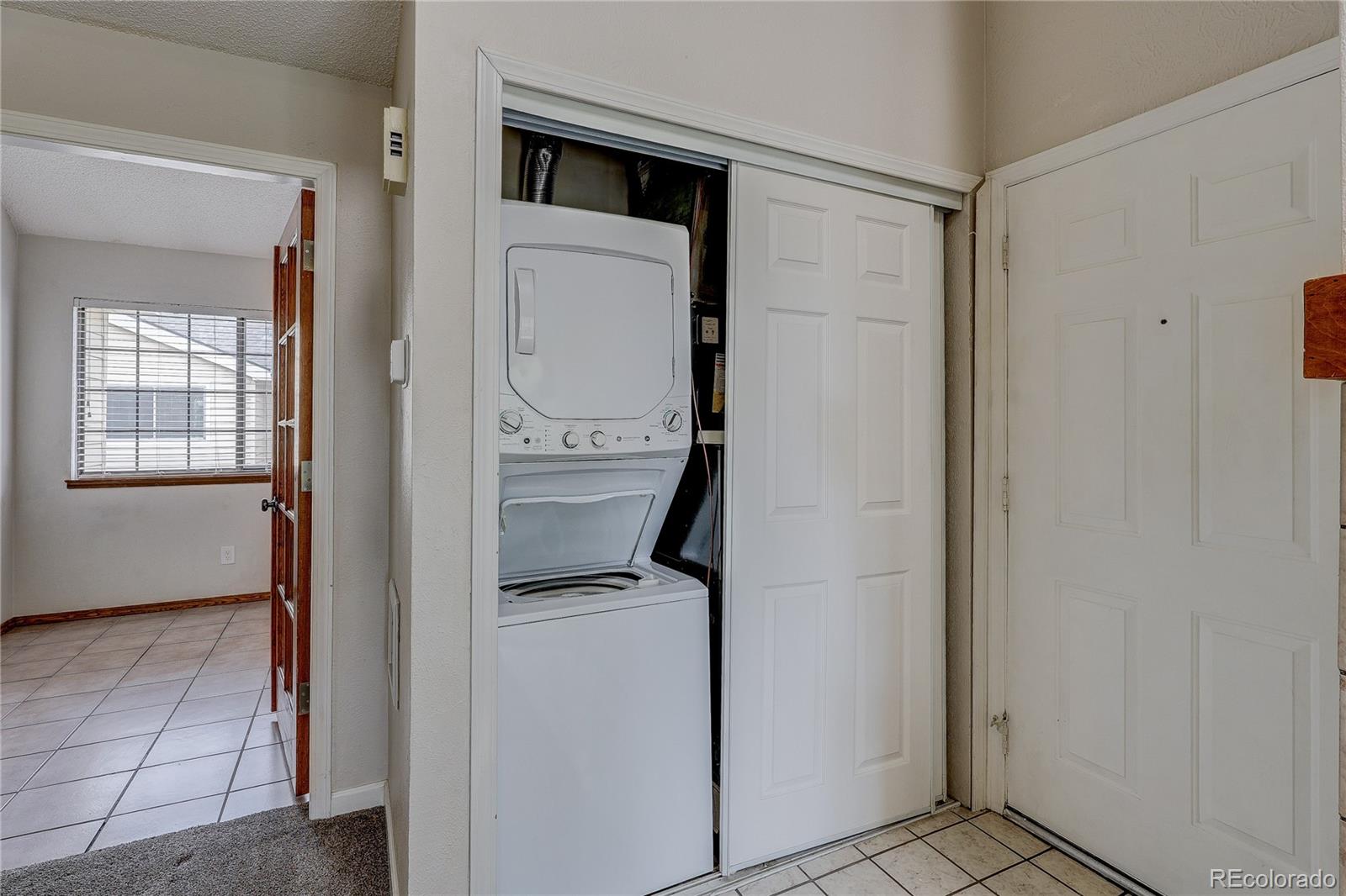 4824 East Kentucky Avenue, Unit C Denver, CO 80246 - Photo 9 of 17 a utility room with closet dryer and washer